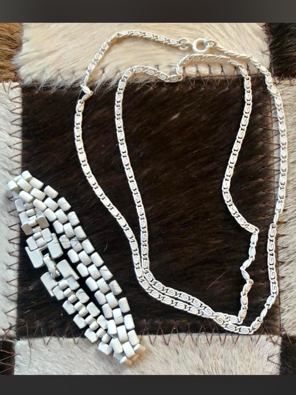 Vintage costume jewelry set featuring a white enamel-coated metal link bracelet